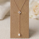 Emma rose gold bridal lariat necklace with CZ centerpiece and elegant pearl drop by Treasures by Agnes.