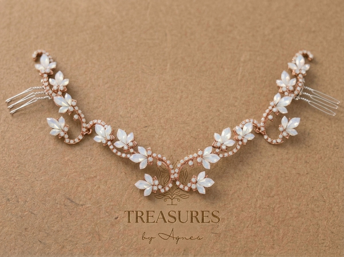 Rose gold Cleo bridal hair vine featuring Swarovski white opal floral crystals, intricate crystal-lined scrollwork and hair comb attachments on a Treasures by Agnes card.