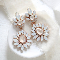 Adaline rose gold bridal earrings with white opal and clear Swarovski crystals in an elegant teardrop design by Treasures by Agnes.